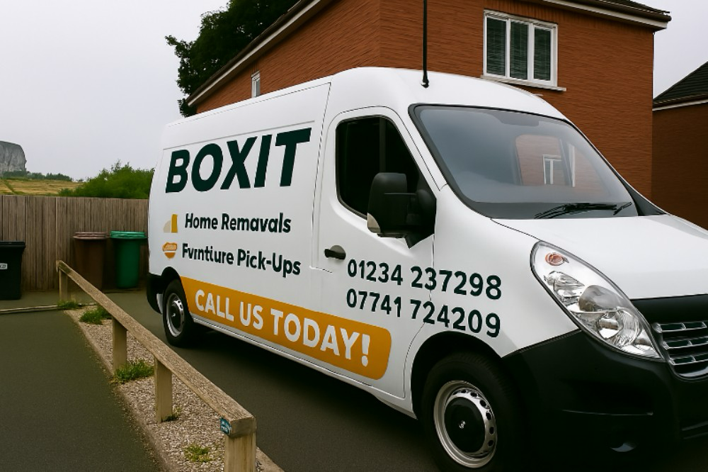Boxit movers handling a sofa carefully